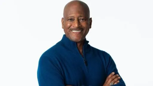 Rod Gilmore stands with arms crossed